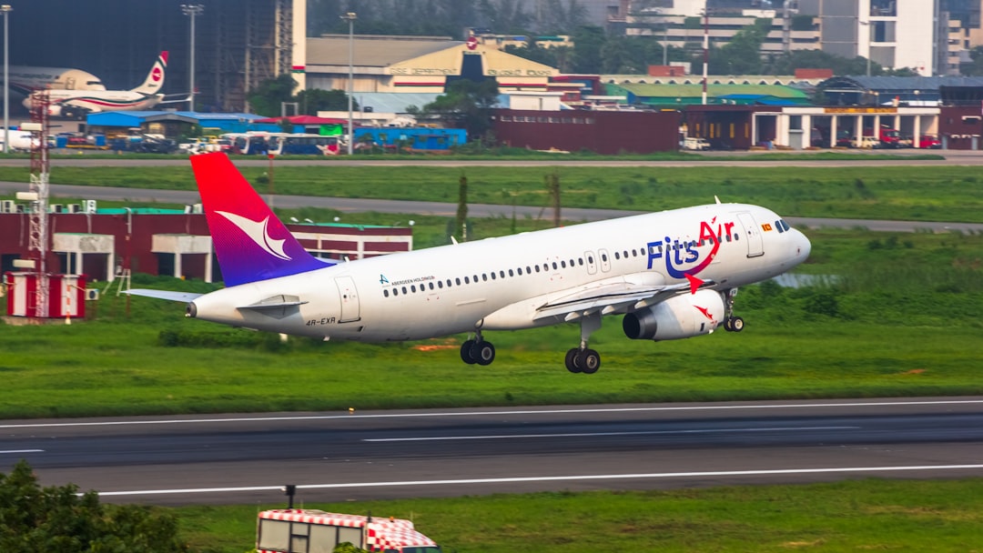a large jetliner taking off from an airport runway,