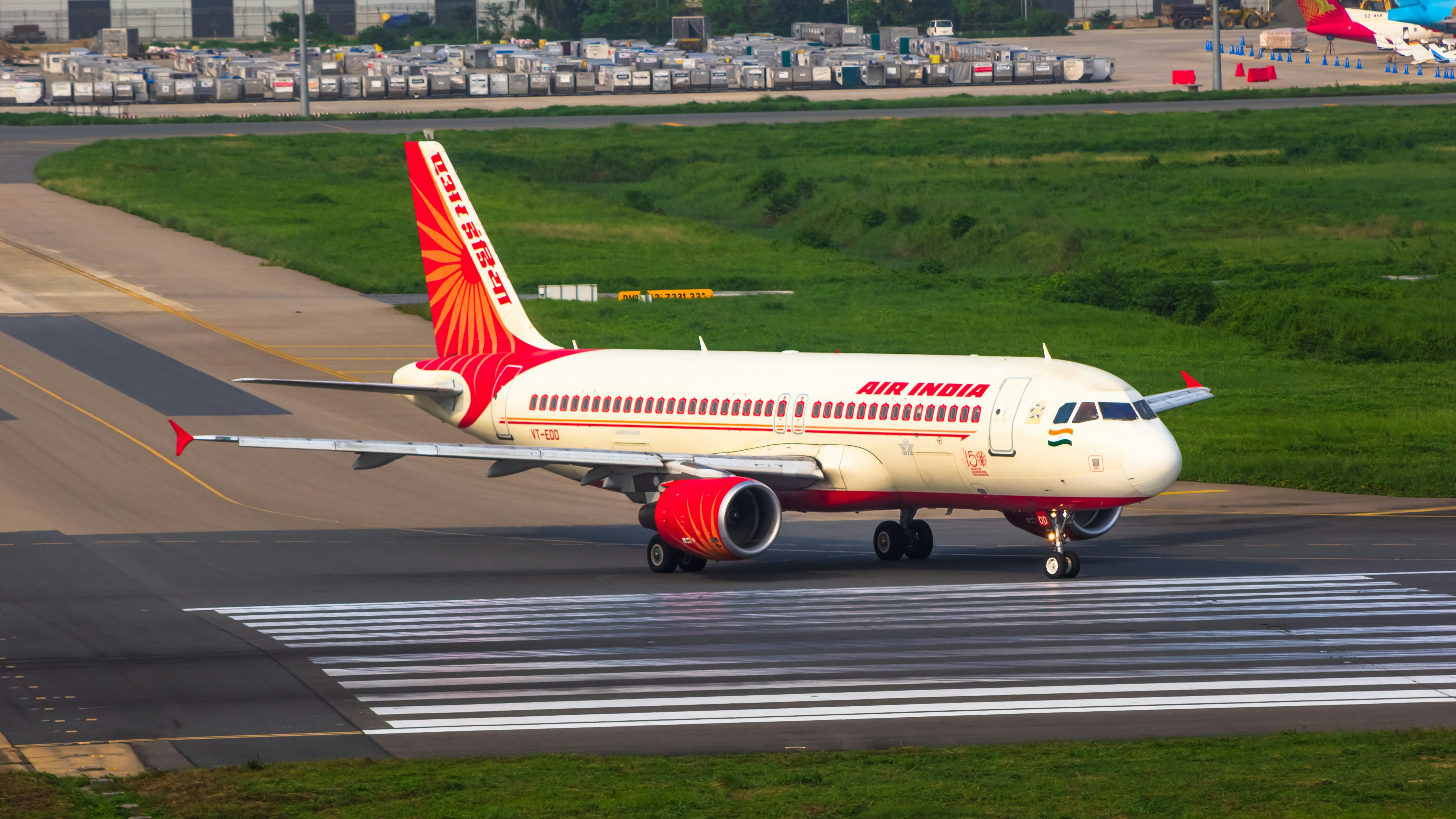 a large jetliner sitting on top of an airport runway, 