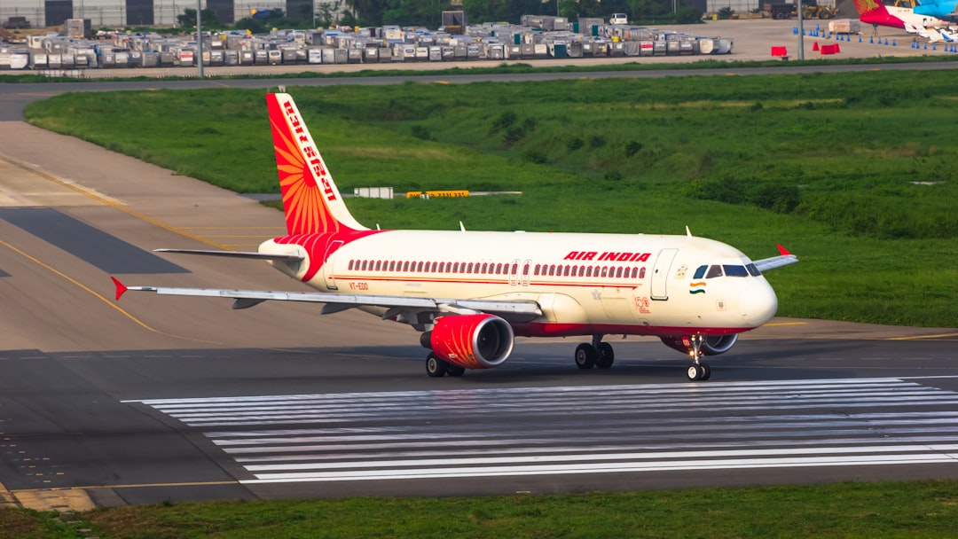 a large jetliner sitting on top of an airport runway,