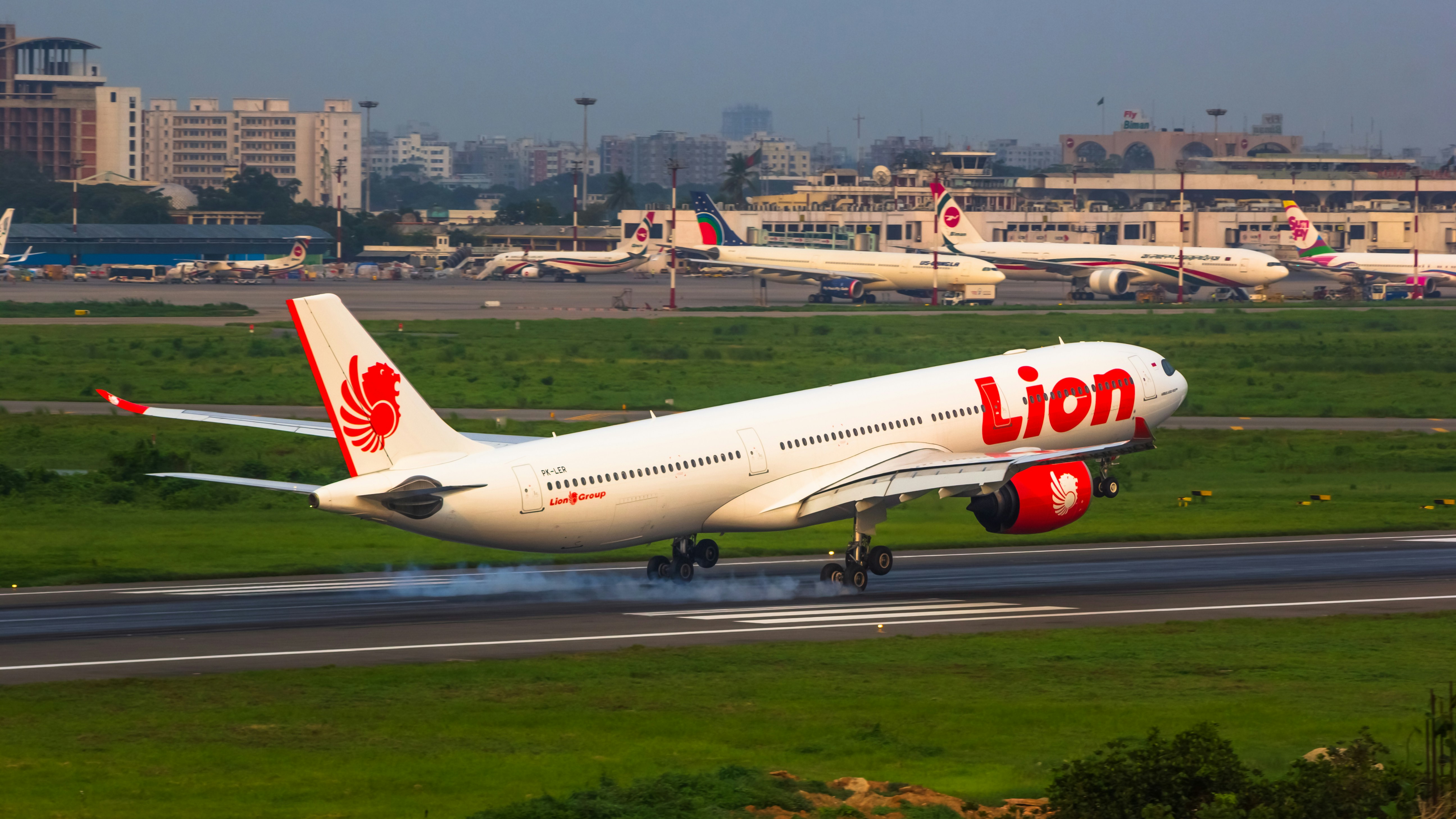 a large jetliner taking off from an airport runway, 