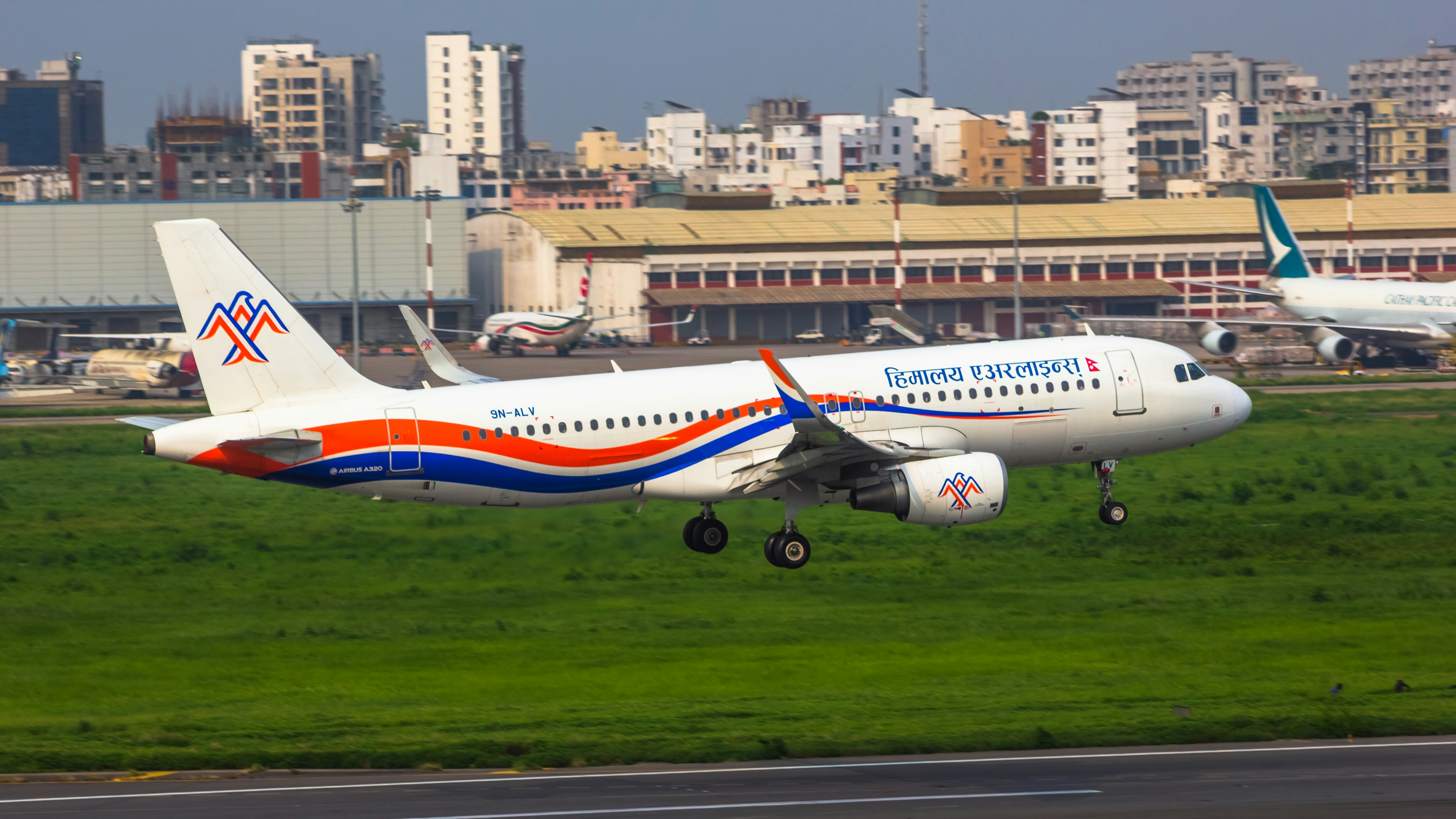 a large passenger jet taking off from an airport runway, 