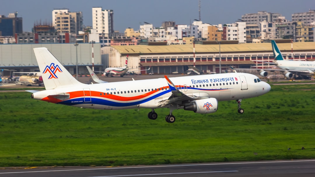 a large passenger jet taking off from an airport runway,