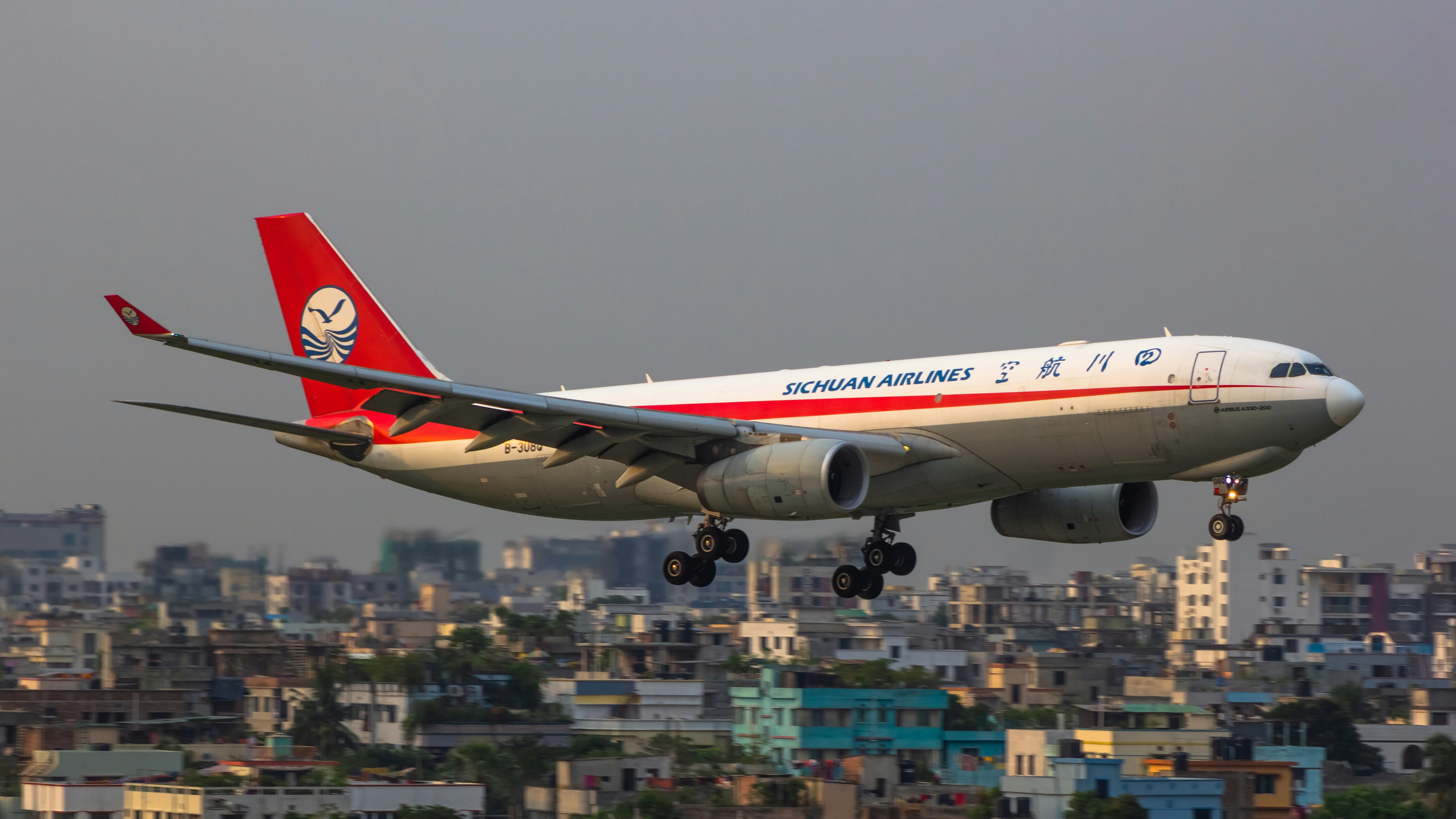 a large jetliner flying through a cloudy sky, 
