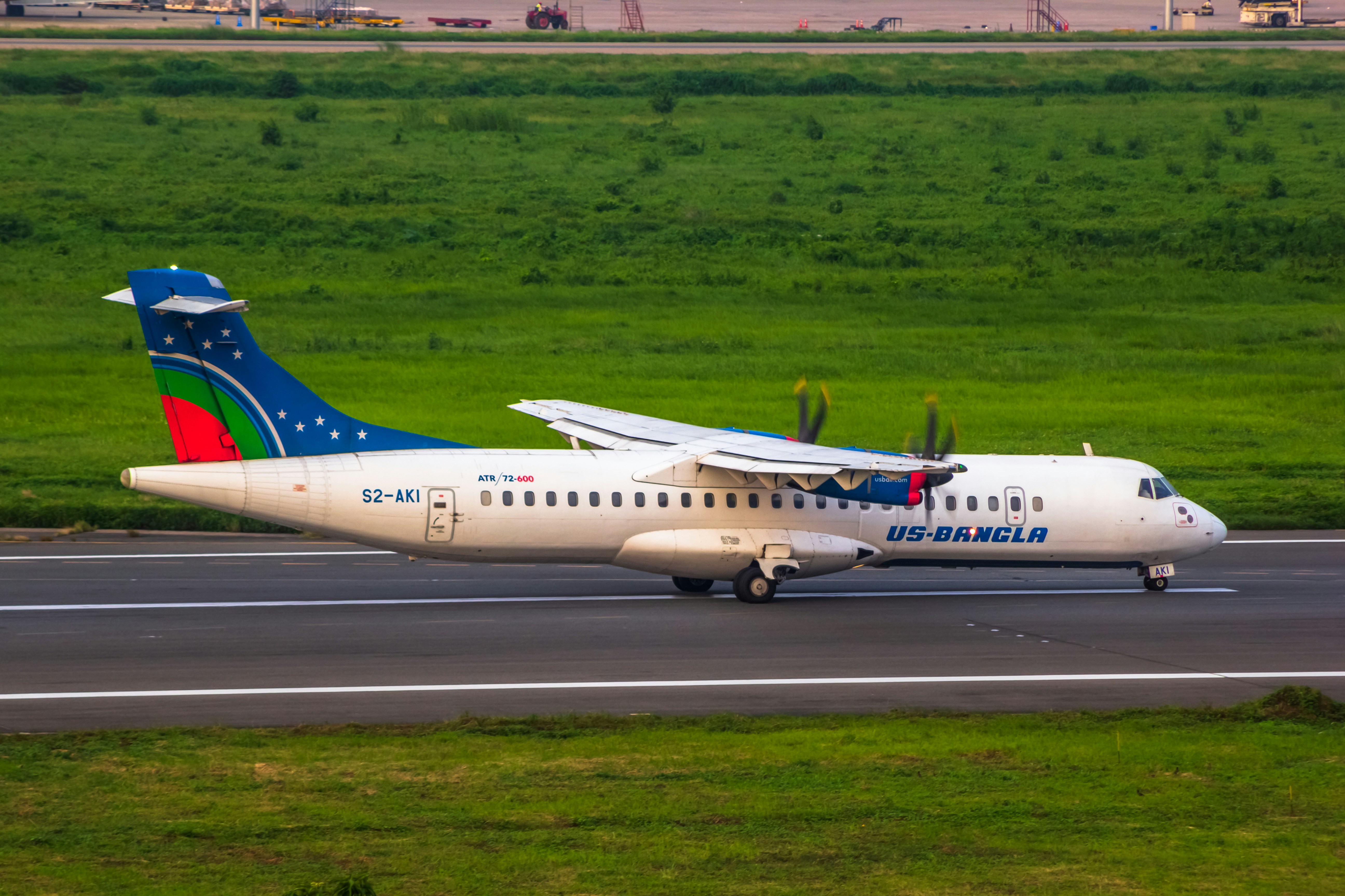 a large jetliner sitting on top of an airport runway, 