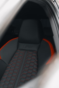 a close up of a car's interior with a steering wheel