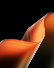 a black background with an orange and yellow wave