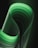 a close up of a green curved object on a black background