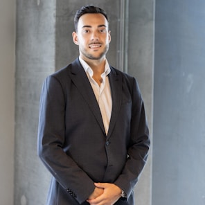 a man in a suit standing in a room