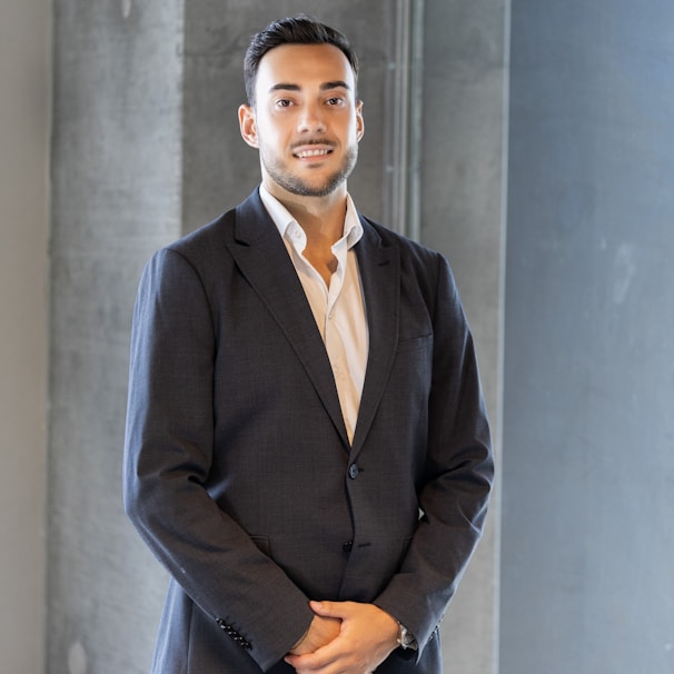 a man in a suit standing in a room