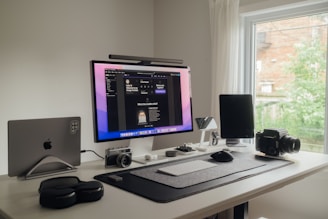 a desktop computer sitting on top of a white desk