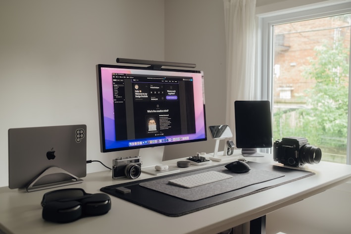 a desktop computer sitting on top of a white desk