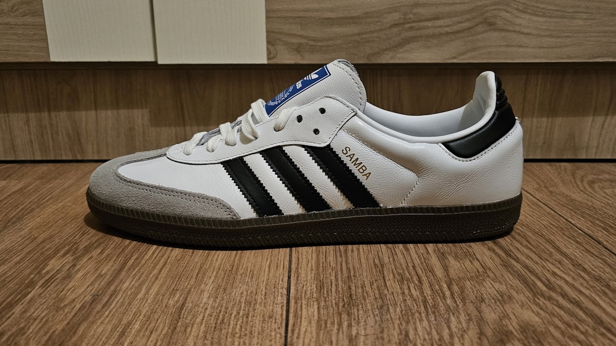 White Adidas Samba sneaker with black stripes