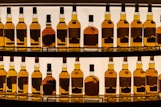 a display of bottles of various types of liquor