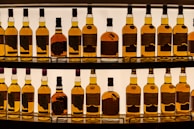 a display of bottles of various types of liquor