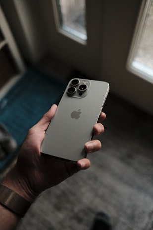 a person holding an iphone in their hand