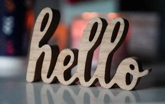 a close up of a wooden word on a table