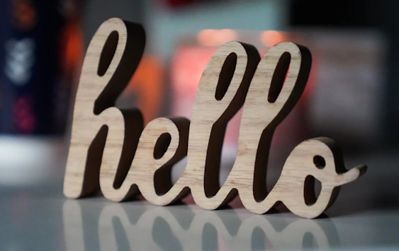 a close up of a wooden word on a table
