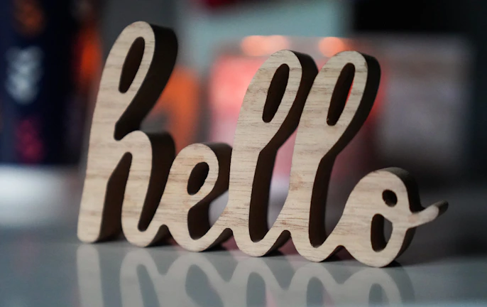 a close up of a wooden word on a table
