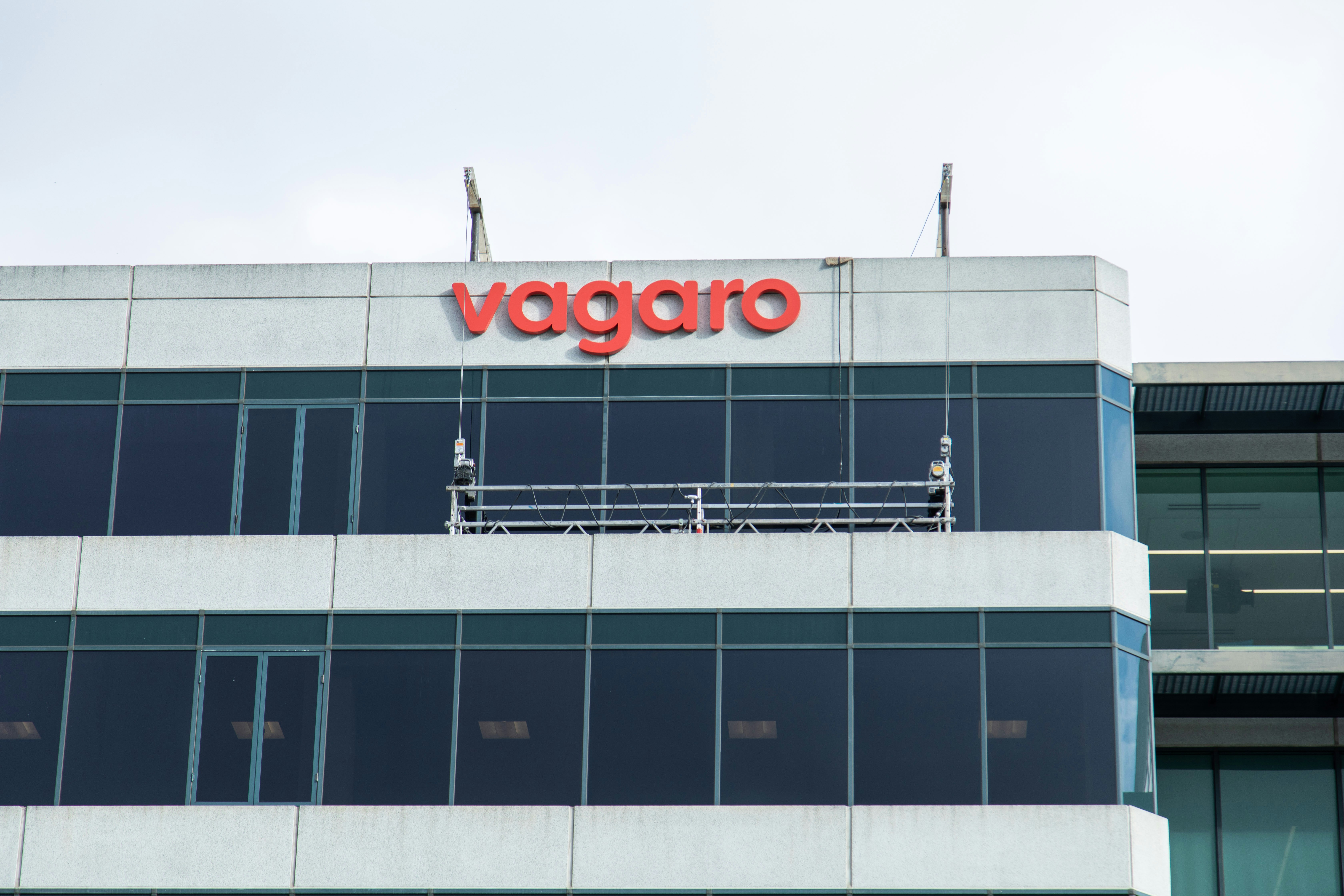 A building with a sign that says vaggro on it photo – Free Office Image ...