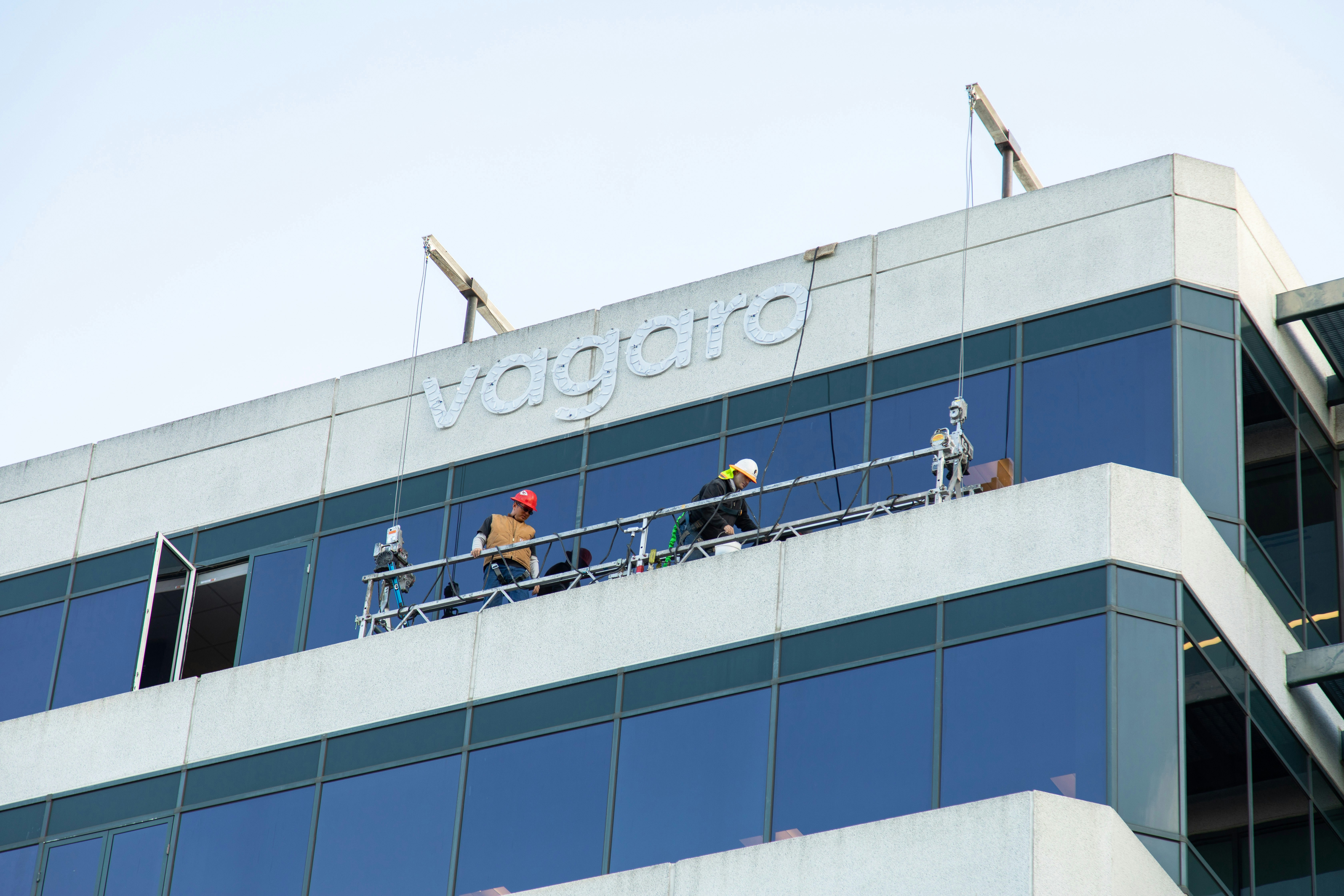a group of people standing on top of a tall building