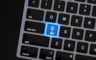 a close up of a keyboard with a blue button
