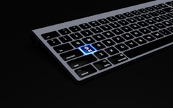 a black keyboard with a blue keyboard sticker on it