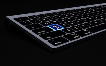 a close up of a keyboard on a black surface