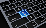 a computer keyboard with a blue light on it