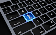 a computer keyboard with a blue light on it