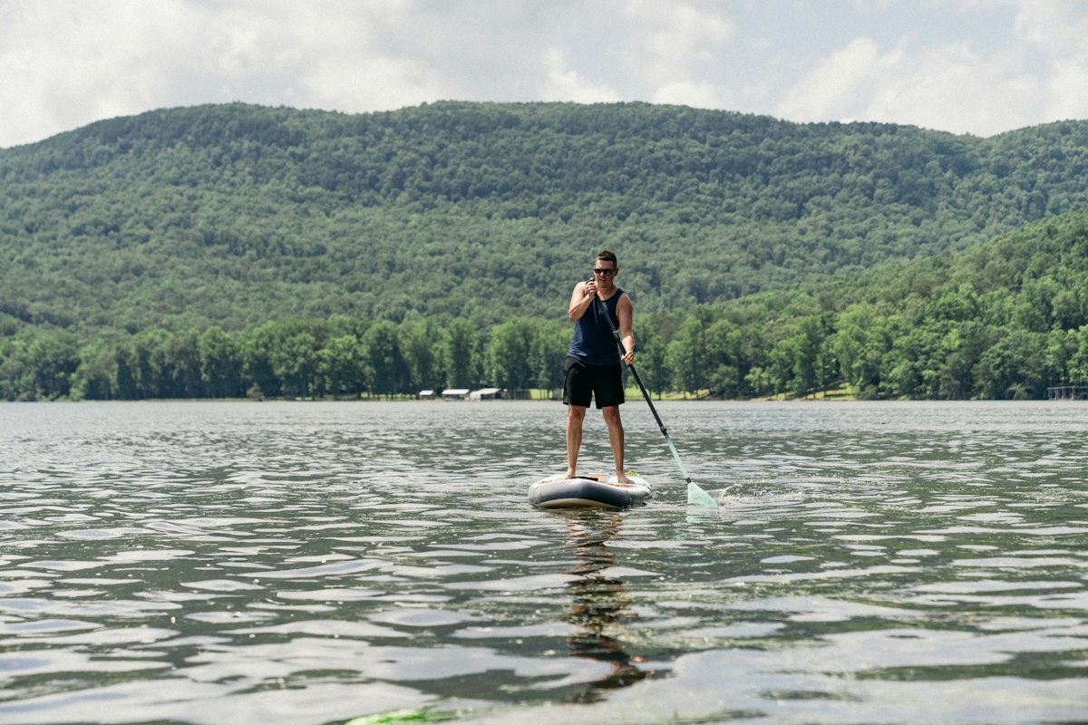 A paddle boarder on a lake