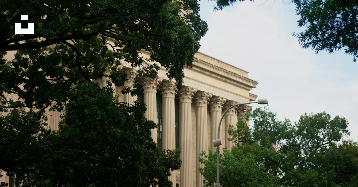 Washington Dc Clock A building with columns and a clock on the side of it photo – Free ...