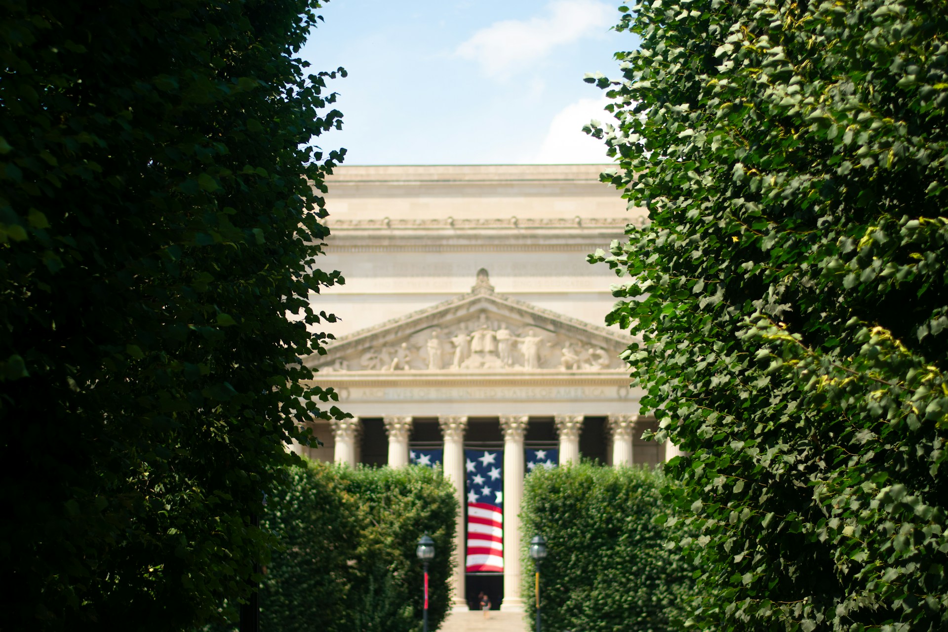 a view of a building through some trees
