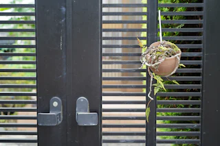 Black metal fence and gate by Young Bros