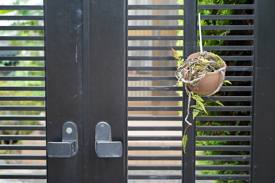 Solid black metal privacy fence and gate installed in British Columbia