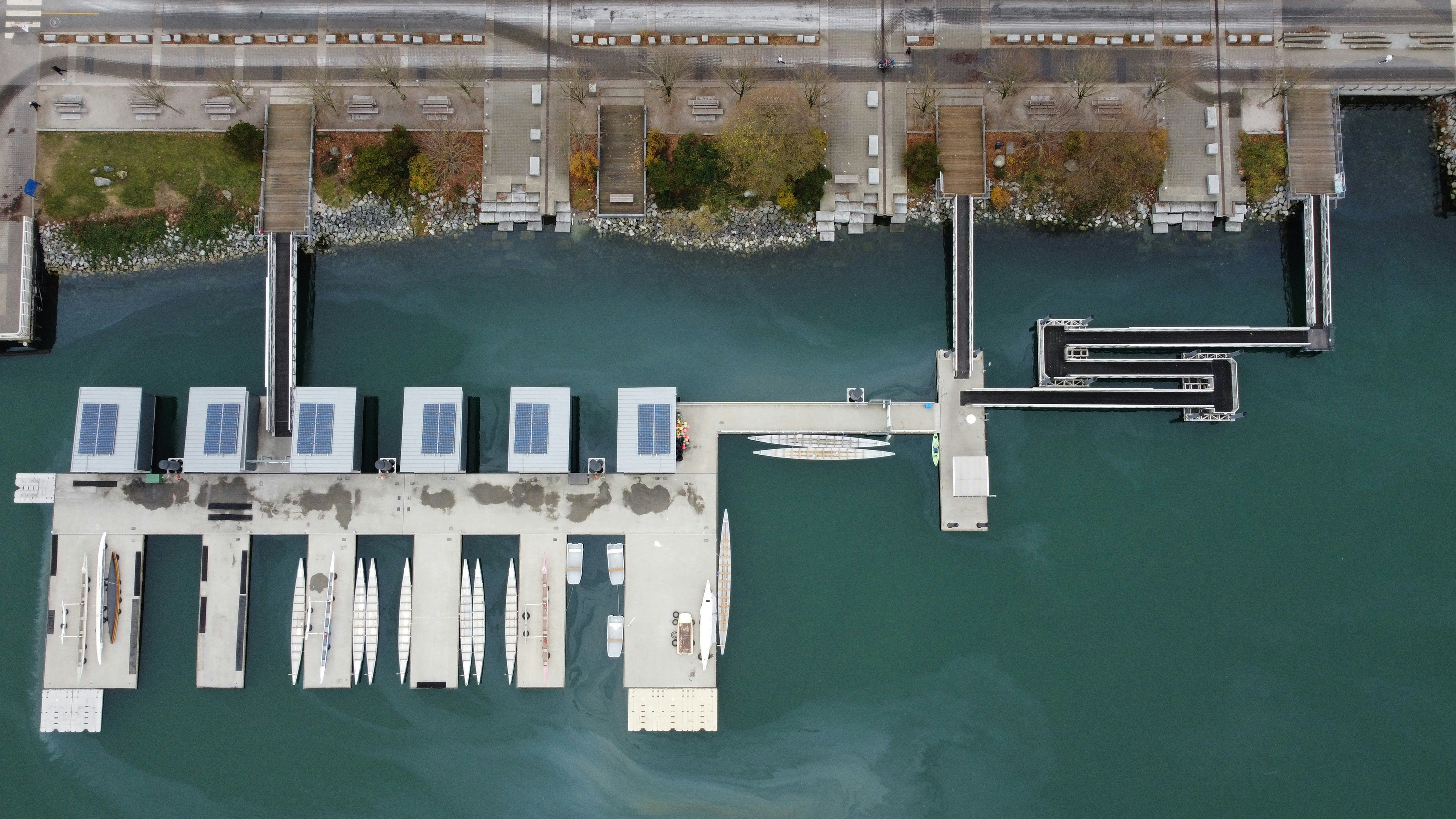 an aerial view of a dock with solar panels