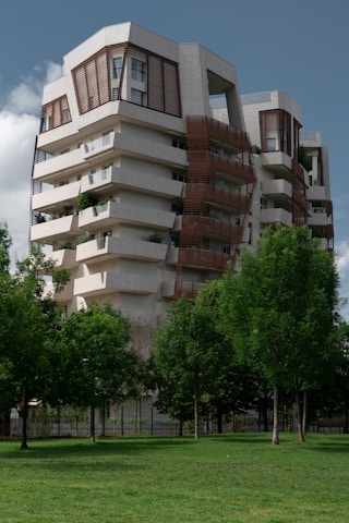 a tall building with balconies on top of it