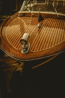 a close up of a wooden boat on a body of water