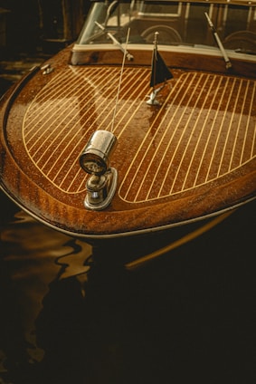 a close up of a wooden boat on a body of water