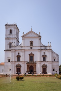 a large white building with a clock tower