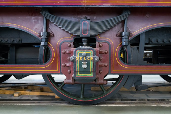 Close-up of vintage train wheels and undercarriage at a railroad museum