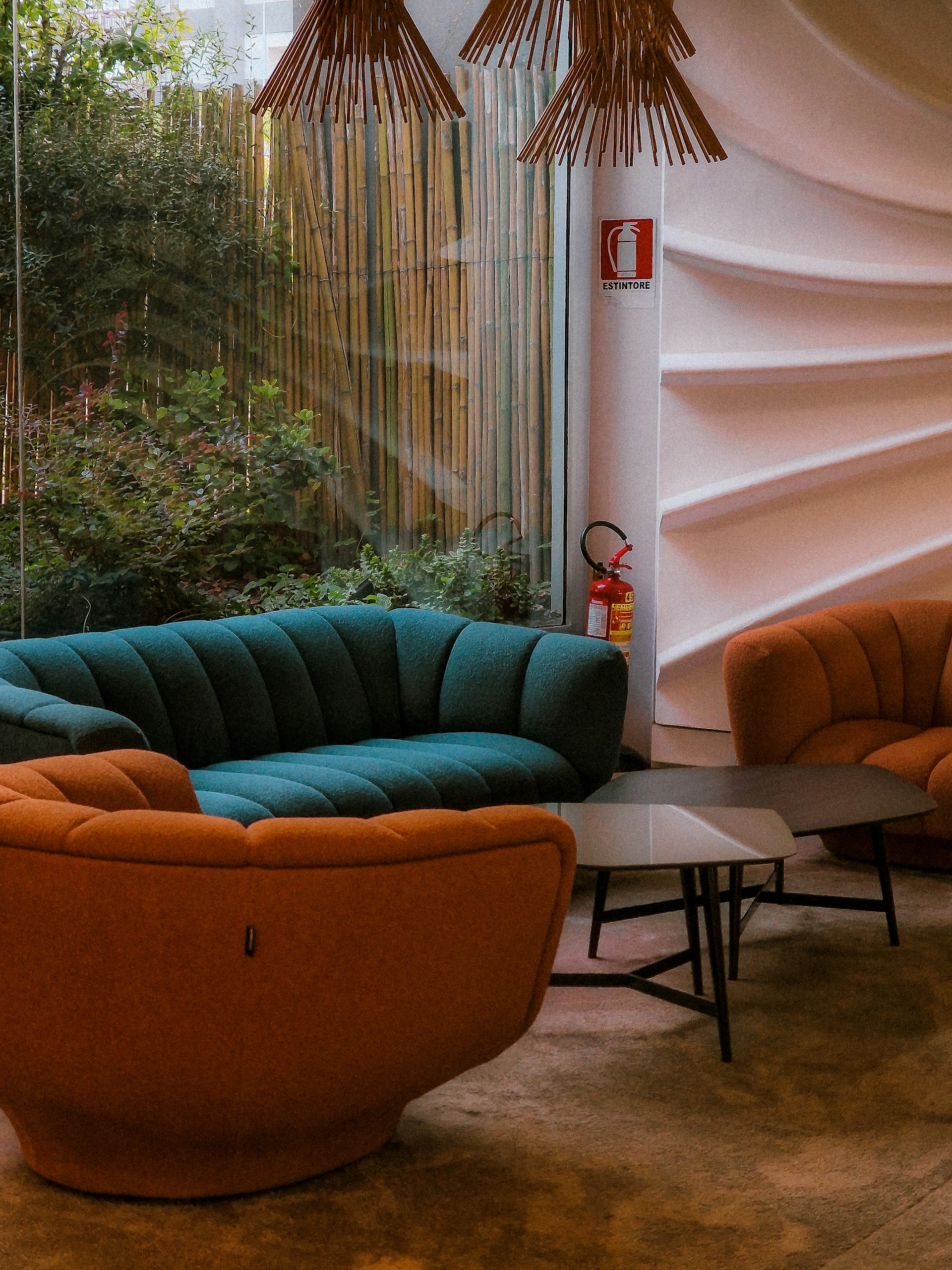a living room filled with furniture next to a window