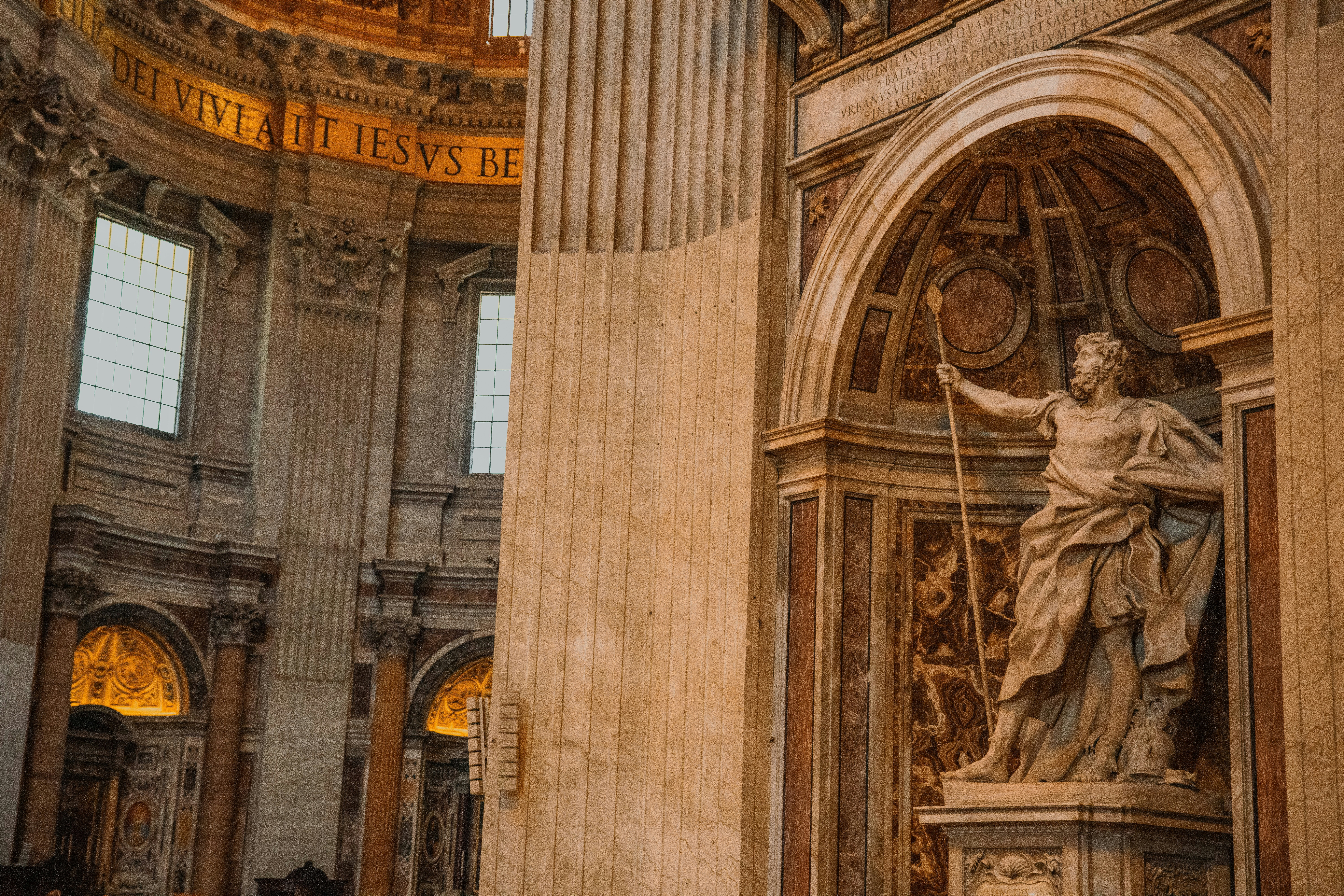 a statue of a woman holding a clock in a building, 