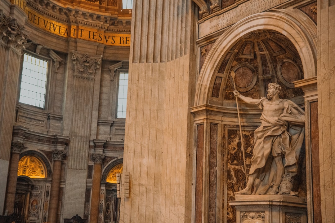 a statue of a woman holding a clock in a building,