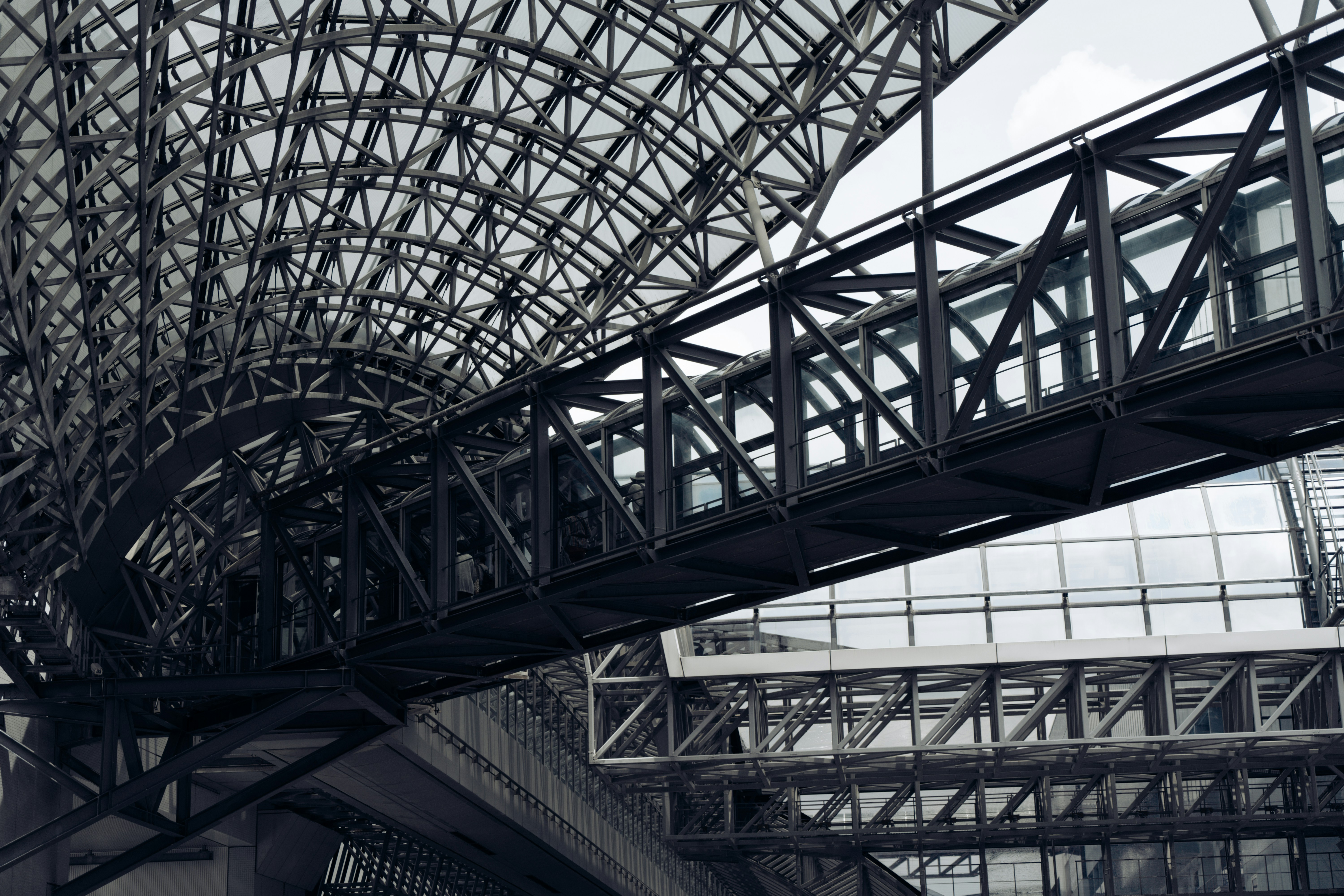 a large metal structure with a clock on it's side