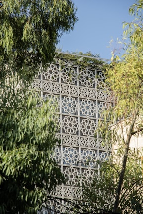 a building that has a decorative design on the side of it