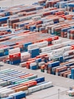 a large group of shipping containers are stacked together