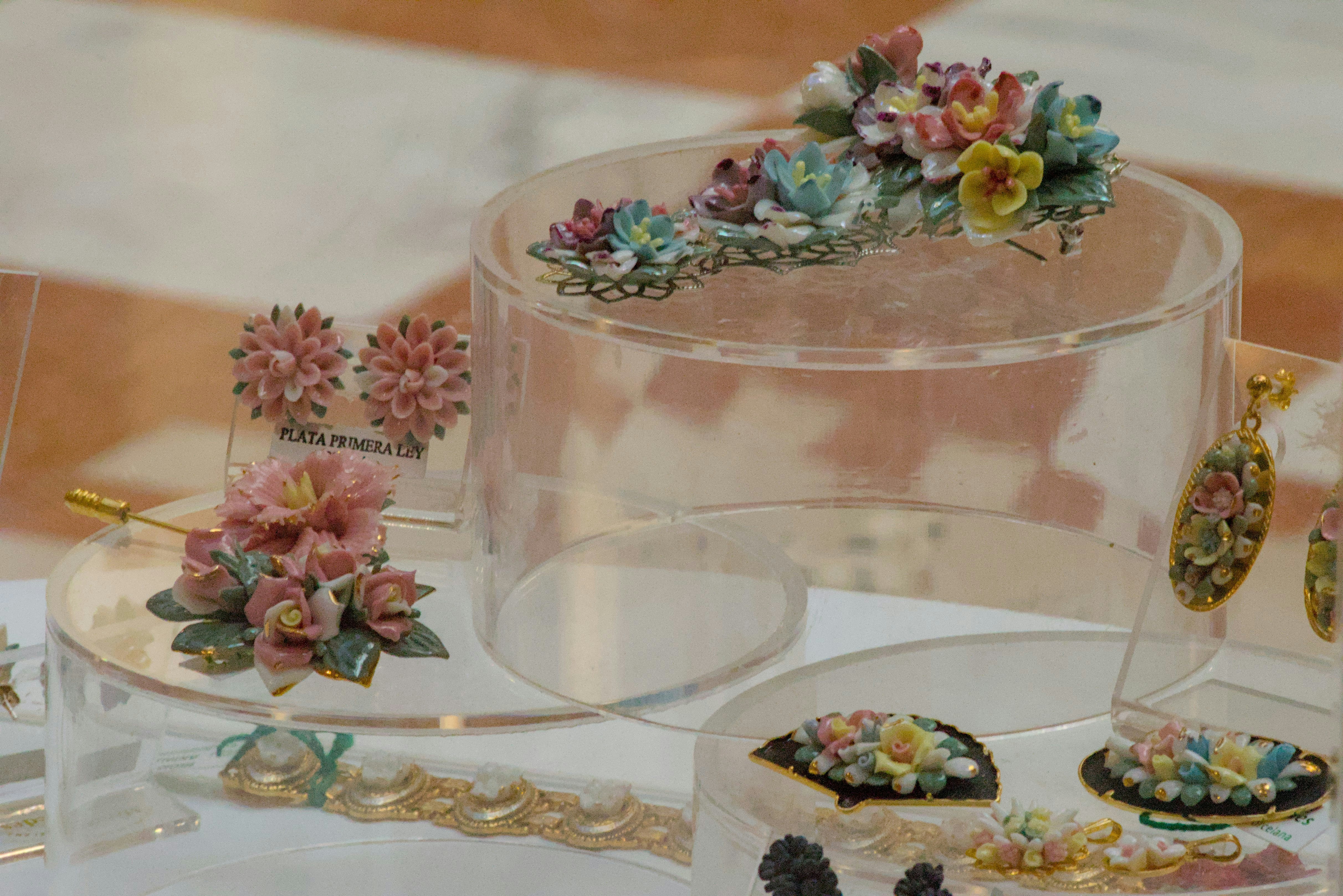 a table topped with lots of different types of jewelry