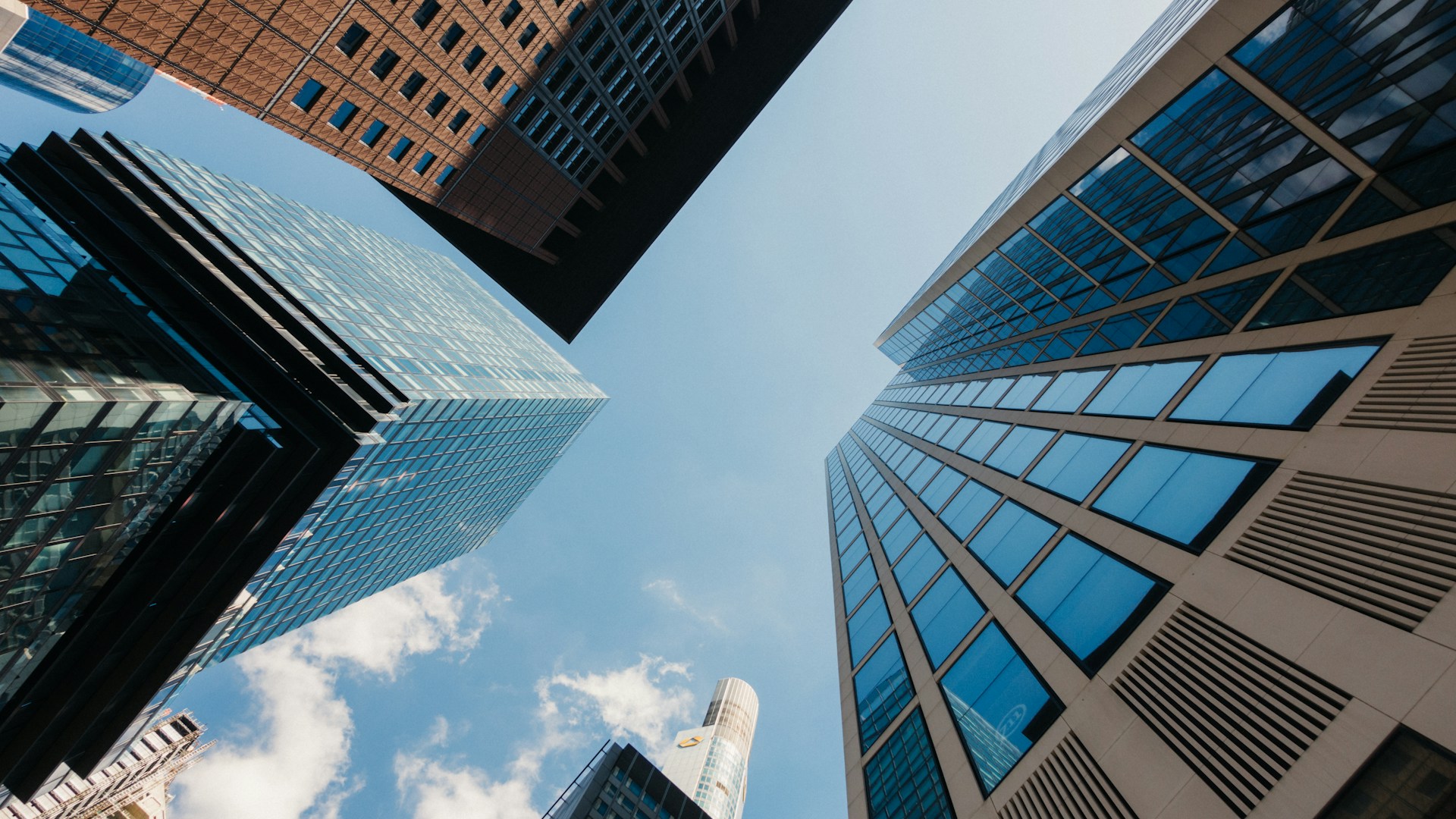 Looking up at tall buildings in a city