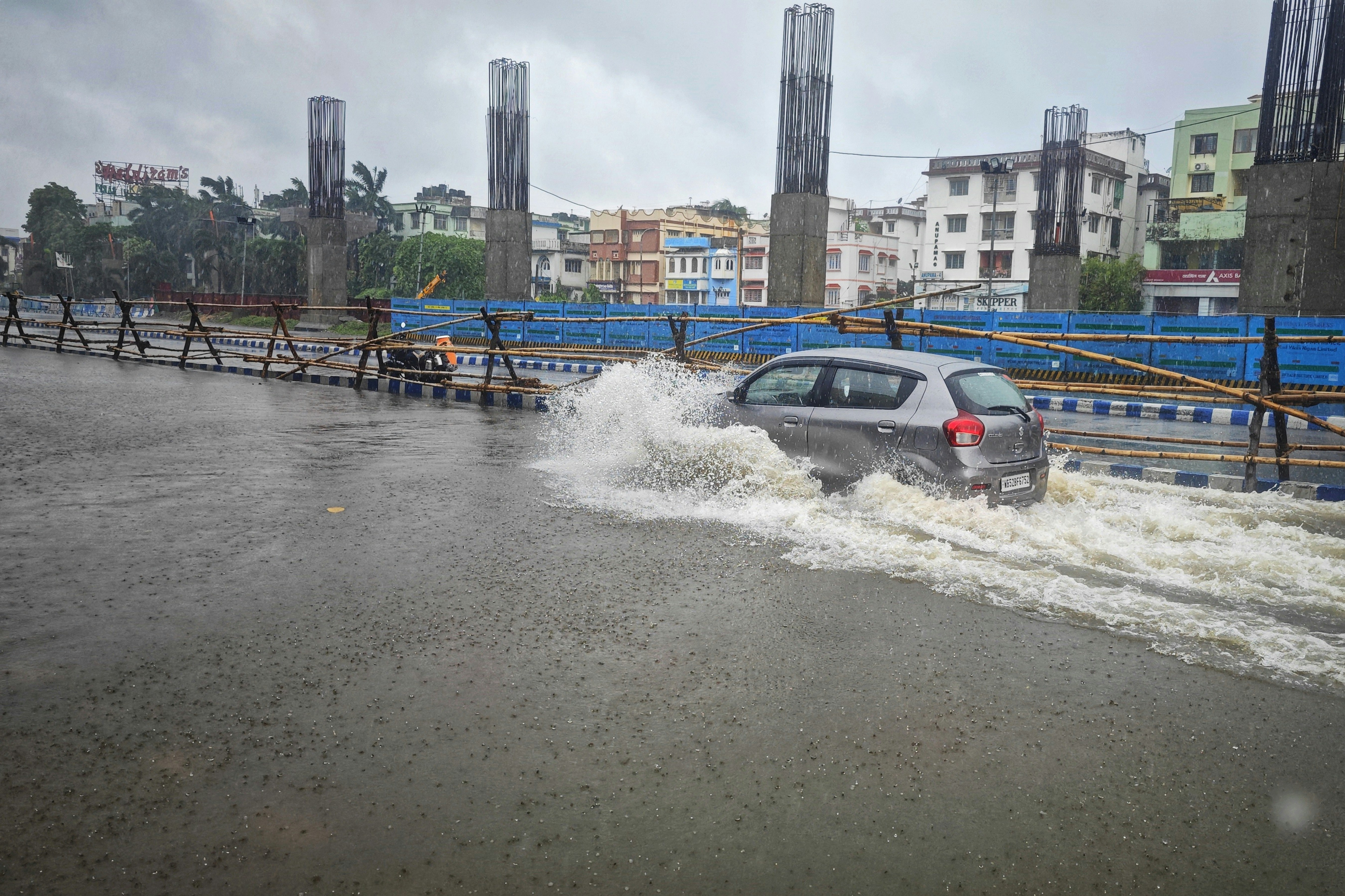 a car is driving through a flooded street