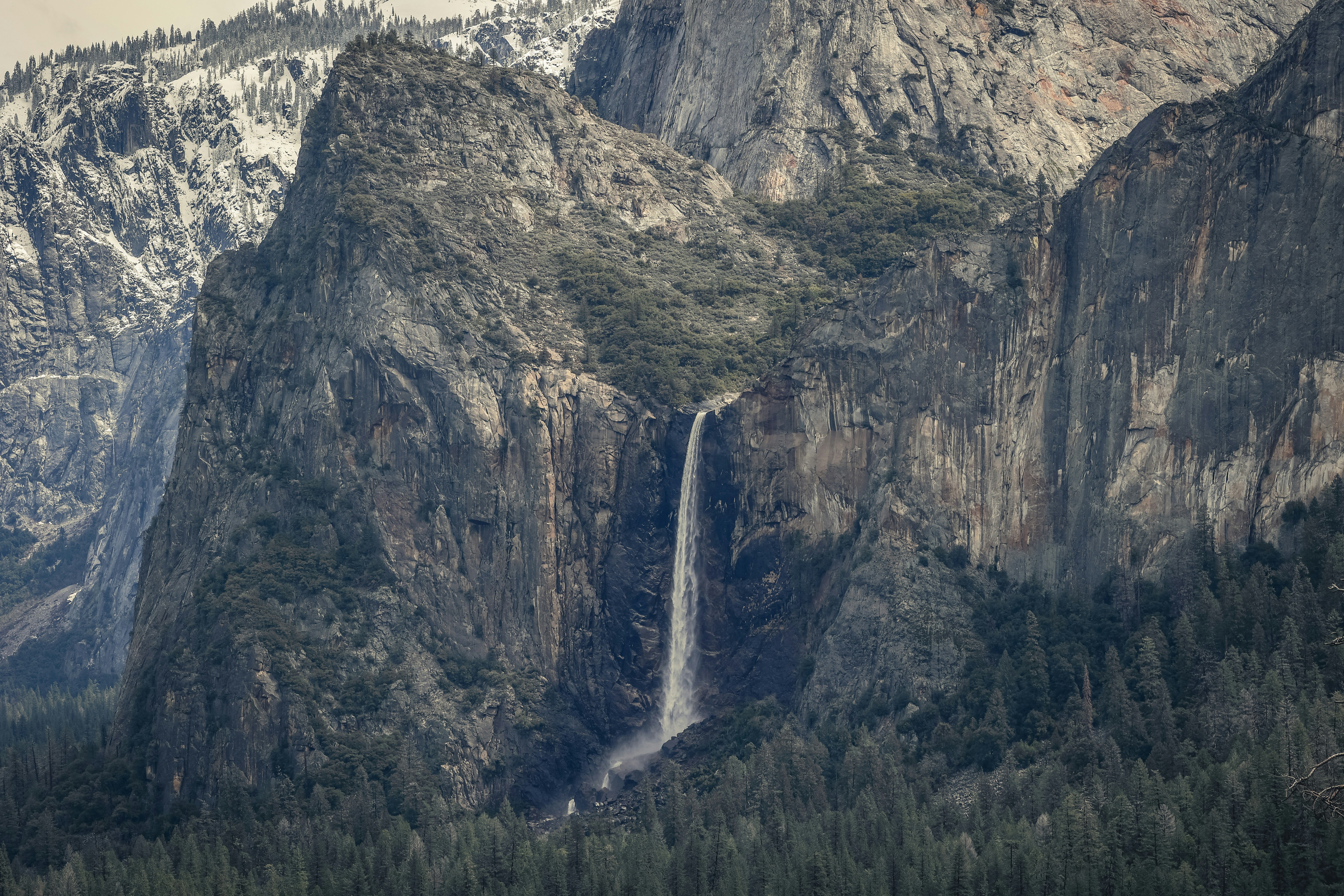 a mountain with a waterfall in the middle of it